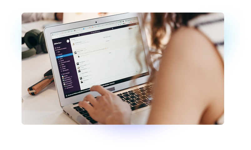 Person working on laptop with email platform